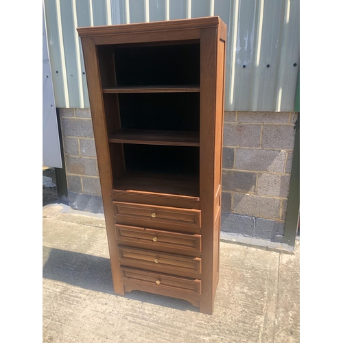 39 - A continental oak bookcase, 4 shelves over 4 drawers 78 x 36 x 190cm