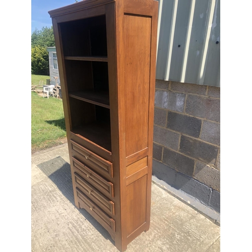 39 - A continental oak bookcase, 4 shelves over 4 drawers 78 x 36 x 190cm
