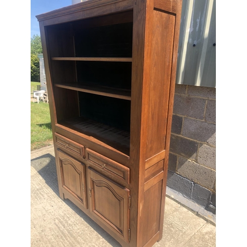 40 - A continental oak bookcase, two shelves over cupboard base 118x 37 x 190cm