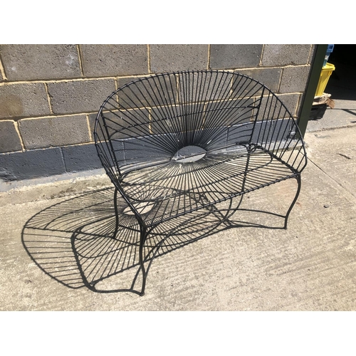 47 - A black painted metal wirework bench 110cm x 48cm x90cm
