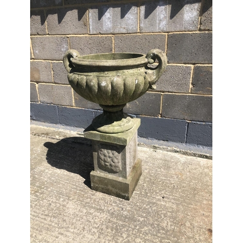 48 - A concrete garden urn on square plinth 90cm h 60cm wide