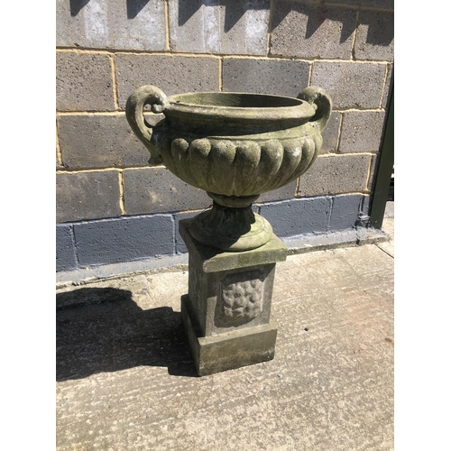 48 - A concrete garden urn on square plinth 90cm h 60cm wide