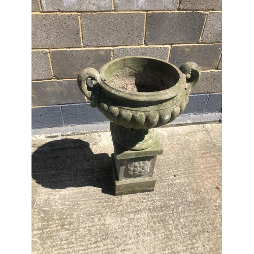 48 - A concrete garden urn on square plinth 90cm h 60cm wide