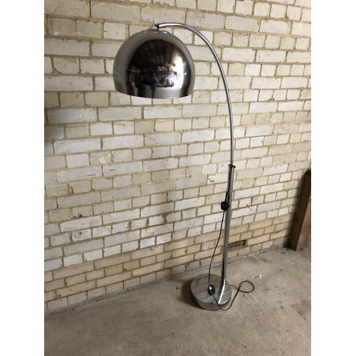 17 - A 1970's inspired floor standing chrome lamp