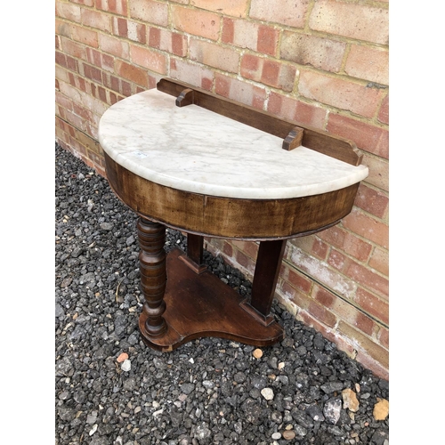 56 - A Demi lune Victorian Mahogany washstand with marble top 76x38x77