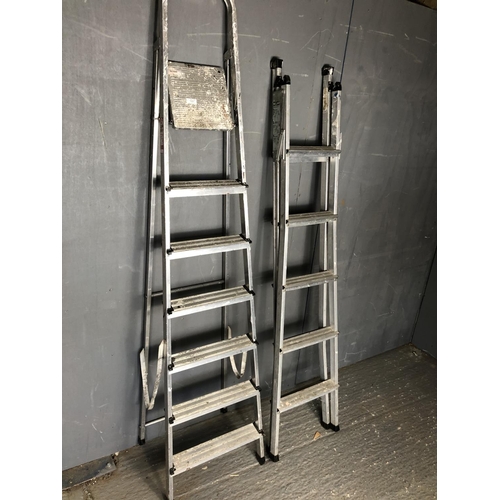 Young man step ladder and a black and Decker 3 in one folding ladder