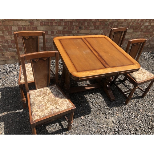 101 - Oak drawer leaf table and four chairs