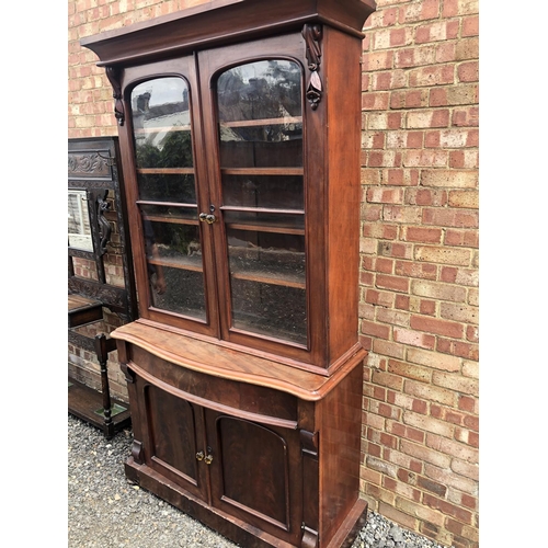 104 - A Victorian mahogany bookcase cupboard 124x52x210