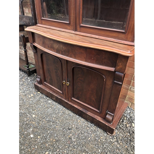 104 - A Victorian mahogany bookcase cupboard 124x52x210