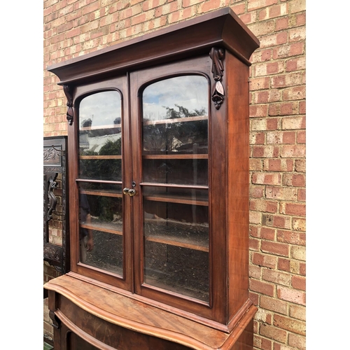 104 - A Victorian mahogany bookcase cupboard 124x52x210