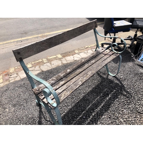 108 - A blue painted cast iron garden bench with wooden slatted seat 130cm long