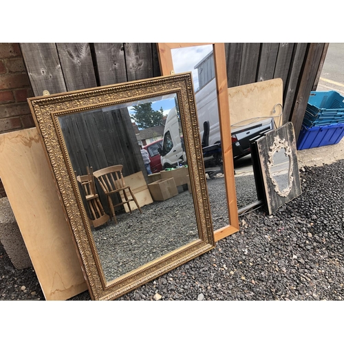 109 - A large gilt framed mirror together with a pine mirror and two modern mirrors