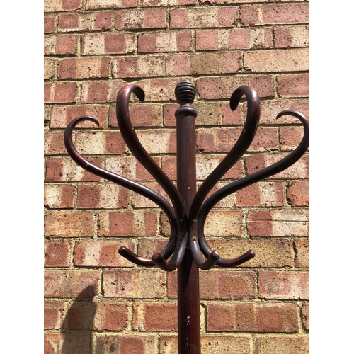 115 - A Demi lune bentwood coat stand