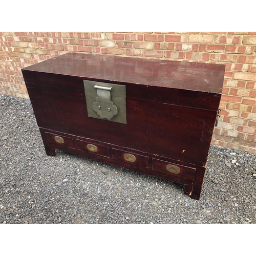 127 - A very large Chinese blanket box chest, lift up lid with brass lock mechanism, over a four drawer ba... 