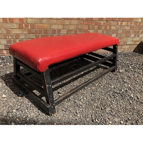 15 - A red vinyl upholstered pommel horse top, converted to seating 128x50x50