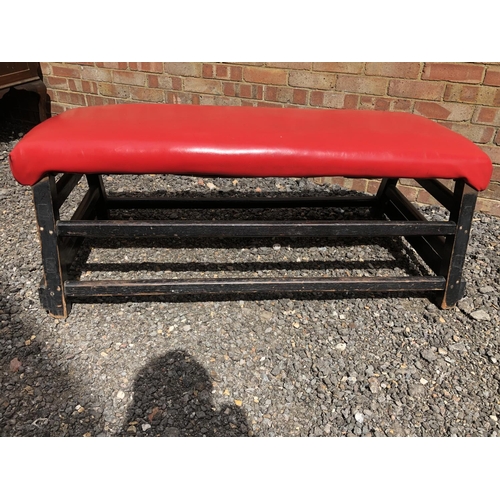 15 - A red vinyl upholstered pommel horse top, converted to seating 128x50x50