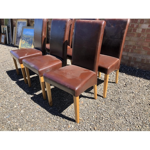 153 - A set lf six brown leather high back dining chairs