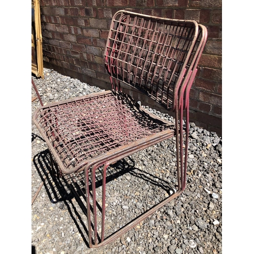 159 - A set of four mid century red stacking basket chairs