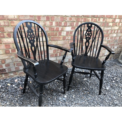 16 - A pair of back wheel back carver chairs