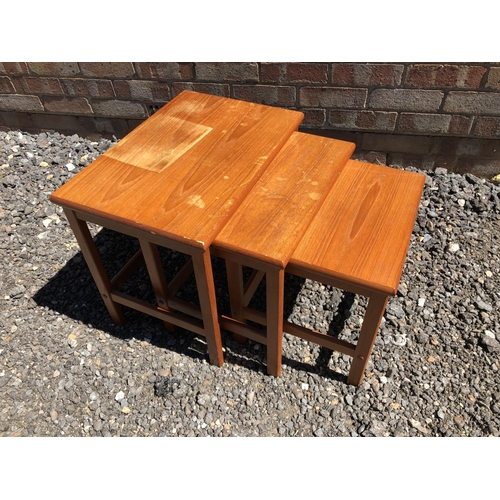 161 - A teak nest of three tables stamped made in Denmark