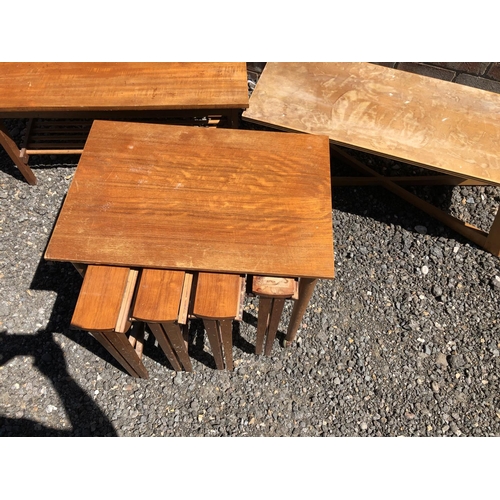 163 - A teak nest of five tables together with two other coffee tables