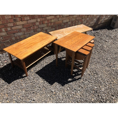 163 - A teak nest of five tables together with two other coffee tables