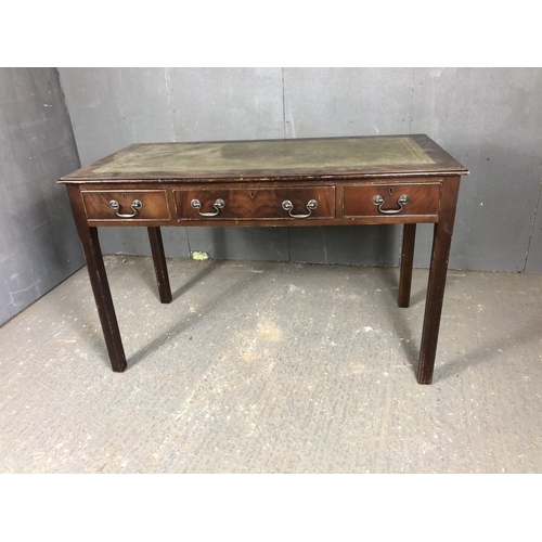 193 - A reproduction mahogany three drawer writing desk 122x60x77