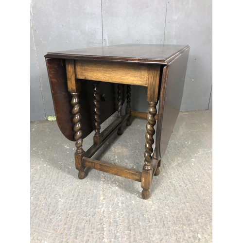 198 - A large oak barley Twist gateleg table