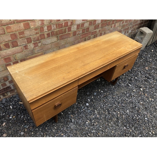 2 - A 1970's teak writing desk with five drawers 152x46x67