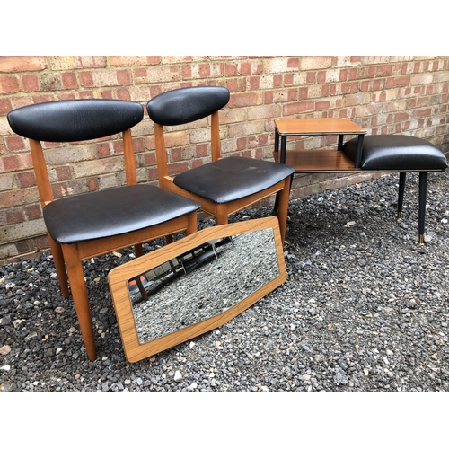 20 - A 1970's telephone table, together with a pair of teak chairs and a wall mirror