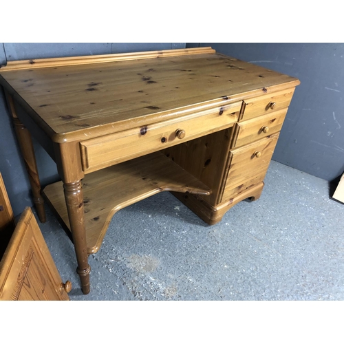 205 - A ducal pine desk together with an upright pine shelving unit