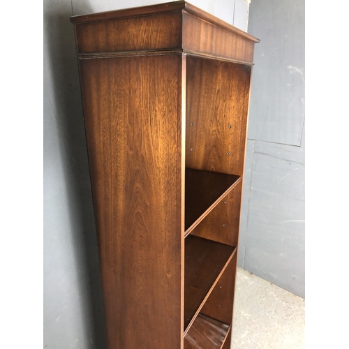 210 - A slim mahogany  reproduction bookcase with six adjustable shelves 56x30x184