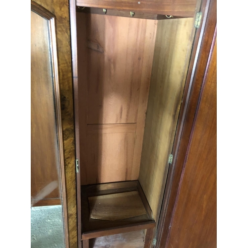 228 - A Victorian walnut triple compactum wardrobe with linen press, draws and hanging compartments 174x50... 