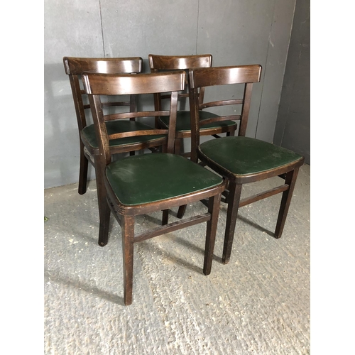 239 - A set of four kitchen chairs