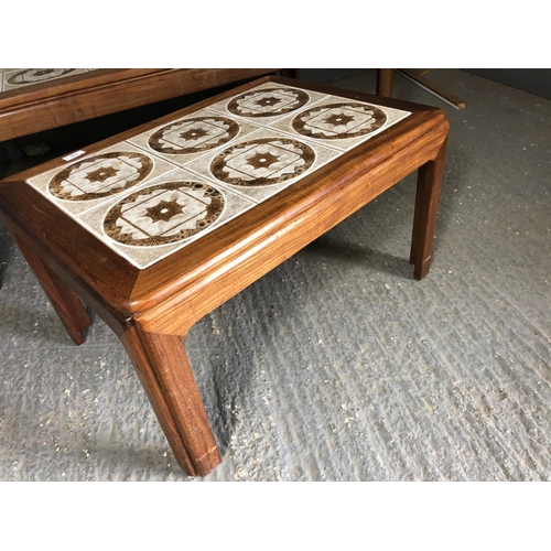 244 - A pair of g plan teak tile top coffee tables, one larger one smaller