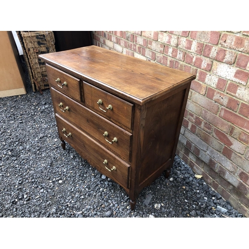 26 - An oak chest of four drawers with brass drop handles 90x45x82