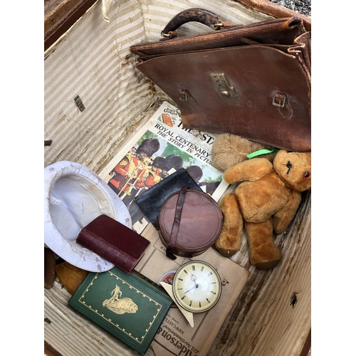 29 - A vintage case containing various toys, leather bag etc