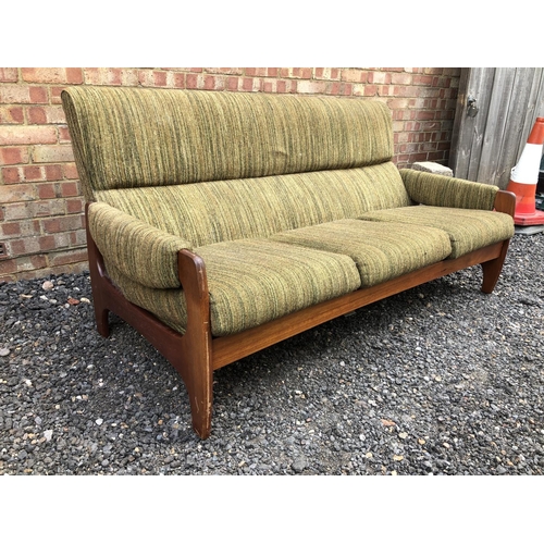 3 - A 1970's Danish style lounge settee, teak frame with green upholstery 180cm wide