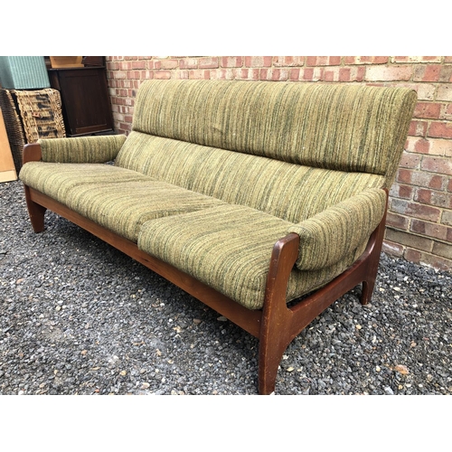 3 - A 1970's Danish style lounge settee, teak frame with green upholstery 180cm wide