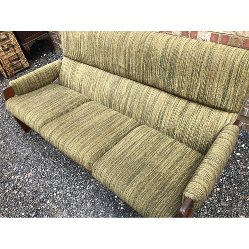 3 - A 1970's Danish style lounge settee, teak frame with green upholstery 180cm wide