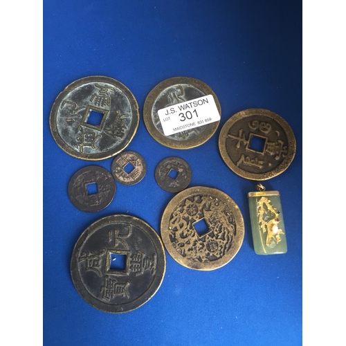 301 - Nine Chinese coins and pendant