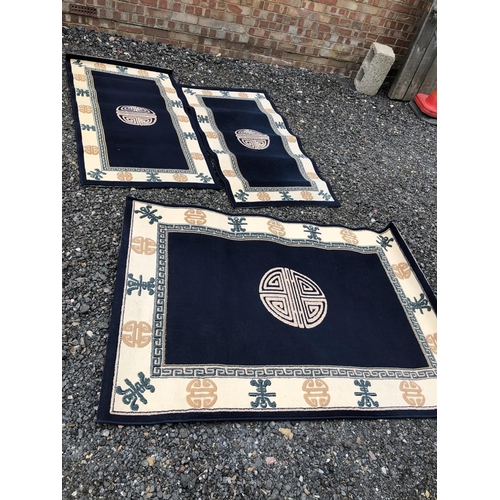 32 - Three modern blue oriental rugs