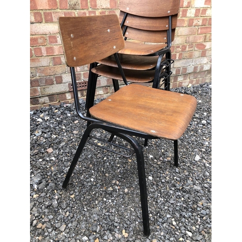 36 - A set of four vintage stacking school chairs, metal frames with bent ply seats