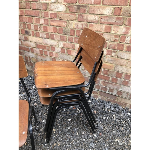 36 - A set of four vintage stacking school chairs, metal frames with bent ply seats