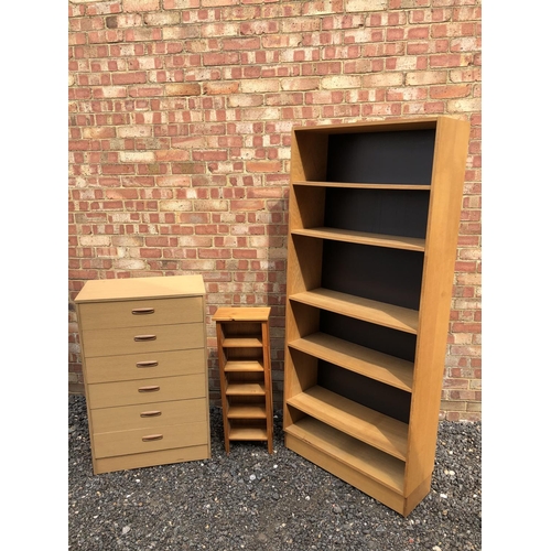 39 - Modern furniture, a chest of six drawers, together with a pine shelf and a tall bookcase