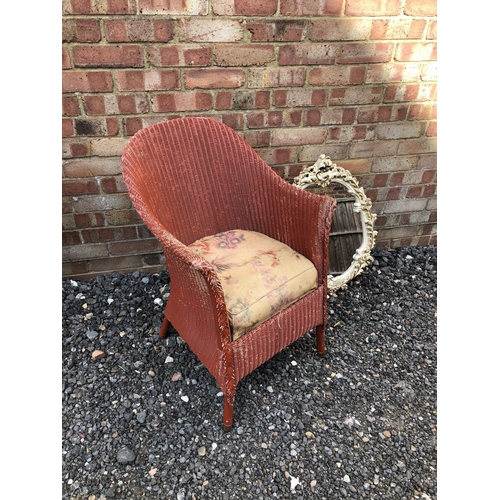 46 - A LLoyd Loom style chair painted red together with a painted mirror