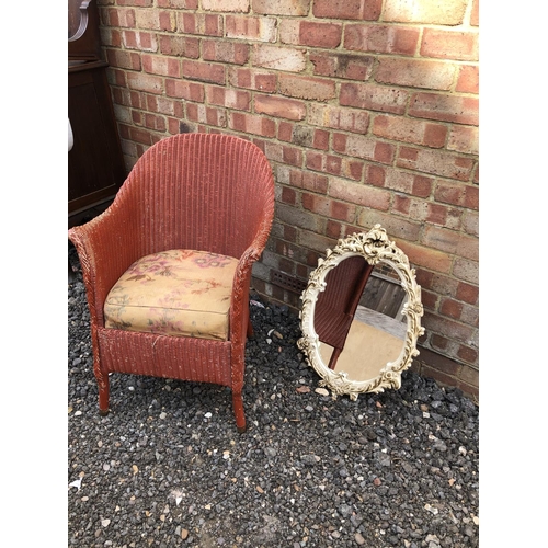 46 - A LLoyd Loom style chair painted red together with a painted mirror