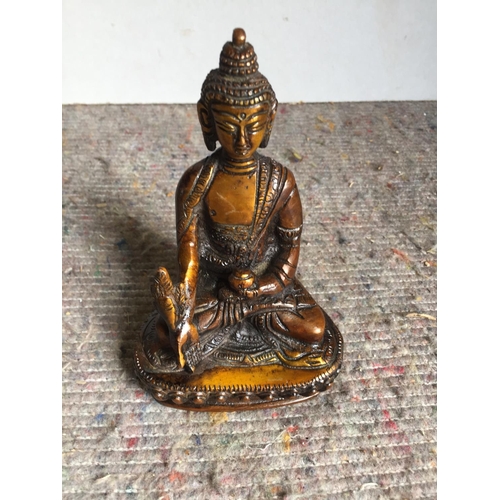 463 - Small bronze Buddha 14 cms tall