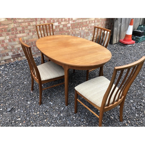 48 - A 1970's oval McIntosh teak dining table together with four chairs