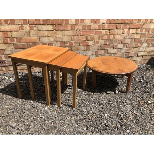 5 - A teak nest of three tables together with a circular coffee table